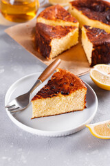 Piece of San Sebastian Basque Cheesecake on the plate on a background.