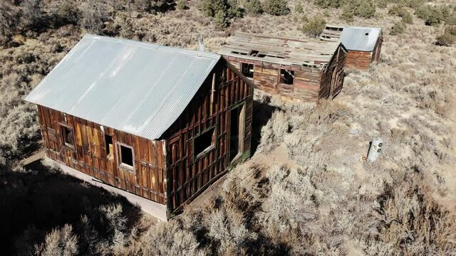 Nevada Cinnabar Mine and Ghost Town.  The Mine Produced Mercury from 1914 to 1918.  Ruins of Several Cabins and a 50 Ton Furnace Remain.  Located in the Shoshone Range near Ione, Nevada.  Aerial Drone