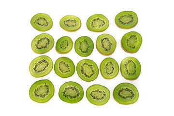 kiwi fruit sliced into circles on a white matte background with a light