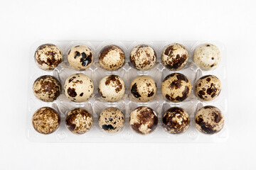 Quail egg pack on a white background. Healthy, breakfast and poultry concept