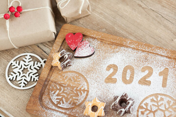Christmas and New Year 2021 background with ingredients for cooking christmas baking decorated with...