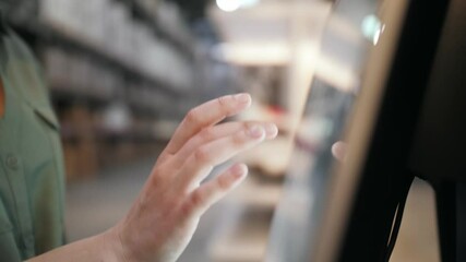 Woman using interactive touchscreen display scrolling and touching. Entertainment and technology concept.