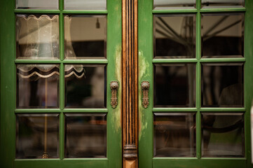 Green window frame in an old European house