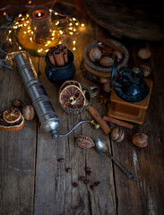 Still life of cinnamon sticks, coffee grains on a wooden table. Copy space.