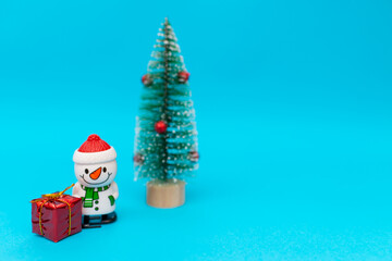snowman, presents and Christmas tree with copy space.new year celebration.