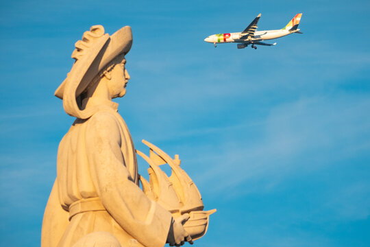 Aircraft Passing Behind The Head Of Henry The Navigator Lisbon