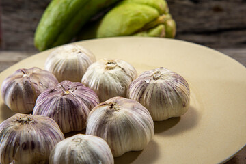 Garlic bulbs in kitchen dish used for seasoning