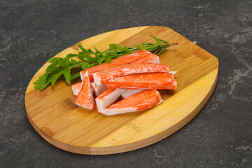 Crab stick surimi over board