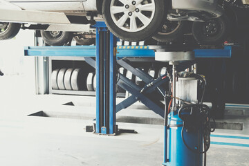 motor oil container for filling old engine oil from car in garage