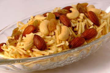 Indian style deep fried snacks falahari chivda- chivda or mixture namkeen with dry fruits.