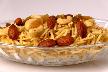 Indian style deep fried snacks falahari chivda- chivda or mixture namkeen with dry fruits.