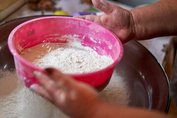 Sifting flour with sieve