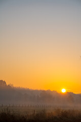 Fototapeta na wymiar at sunrise whit mist