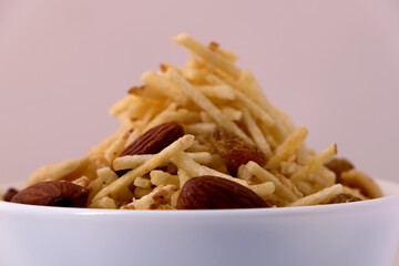 Indian style deep fried snacks falahari chivda- chivda or mixture namkeen with dry fruits.
