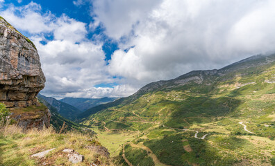 Fototapeta na wymiar Farrapona valley with zig-zag curved road top view