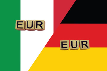Italy and Germany currencies codes on national flags background