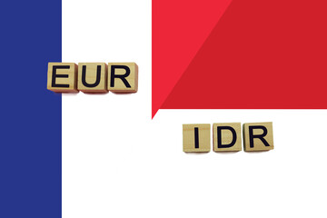 France and Indonesia currencies codes on national flags background