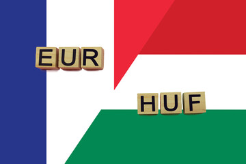 France and Hungary currencies codes on national flags background