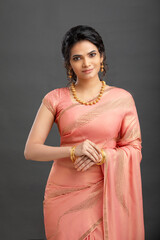 Pretty Indian young girl dress up saree for festival. - obrazy, fototapety, plakaty