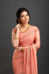 Pretty Indian young girl dress up saree for festival.