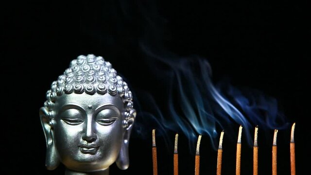  footage of buddha aroma stick dark background 
