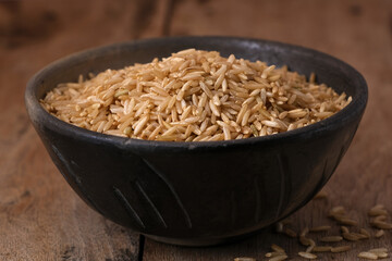 Raw brown rice in a bowl