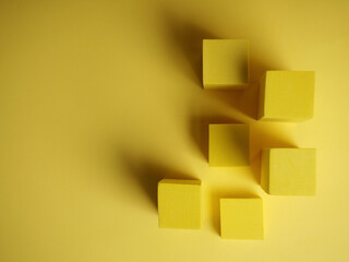 abstract squares on a yellow background with shadows, top view, geometric shapes for demonstration