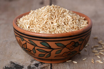 Raw brown rice in a bowl