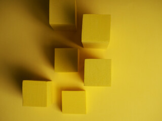 abstract squares on a yellow background with shadows, top view, geometric shapes for demonstration