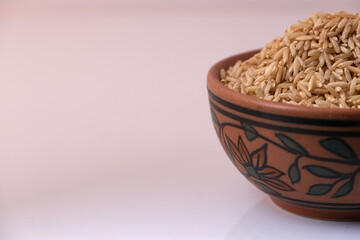 Raw brown rice in a bowl