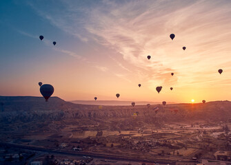 Hot air balloon in Cappadocia on the sunrise.