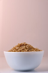 Raw brown rice in a bowl