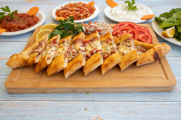 Traditional turkish baked dish pide. Turkish pizza pide, Middle eastern appetizers. Turkish cuisine. Top view. Pide with meat filling.
