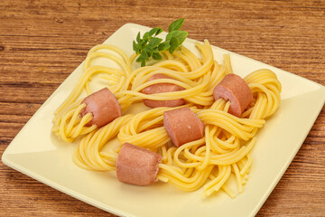 Kids pasta spaghetti with sausages