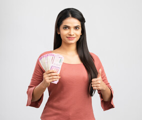 Young woman holding rupee notes-Money savings concept