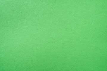 Paper textured background of pastel green or light green color.