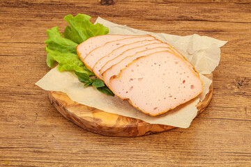 Boiled pork sausage over board
