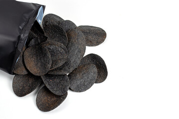 Chips black. Chips with added charcoal and peppers. White background