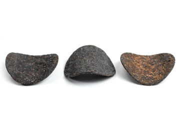 Chips black. Chips with added charcoal and peppers. White background