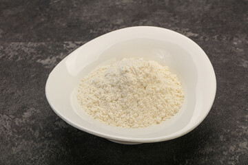 Wheat flour heap in the bowl