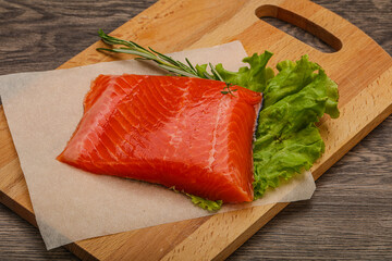 Salmon piece steak served rosemary