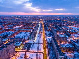 Aerial city winter view with crossroads and roads, houses, buildings, parks. Helicopter drone shot. Wide Panoramic image. Kharkiv, Ukraine