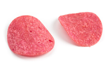 Pink potato chips isolated on white background