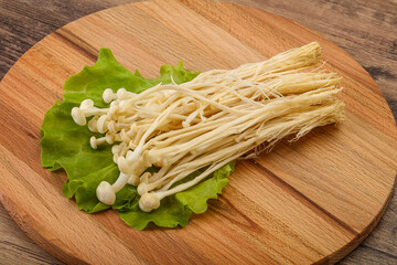 Raw Enoki mushrooms for cooking