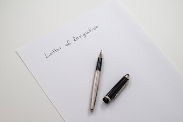 employee writing resignation letter on a blank paper