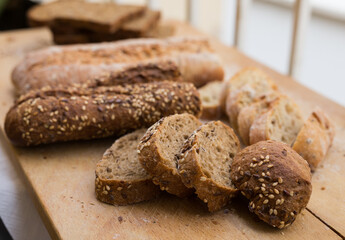 fresh loaf of bread on wooden board