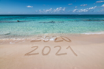 Fototapeta na wymiar New year 2021 written on the beach.