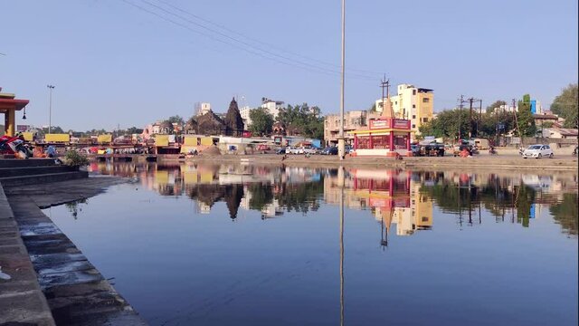 The Bank Of Godavari River With Refection of Temples And Trees - India Nashik, Timelapse 4K Shot