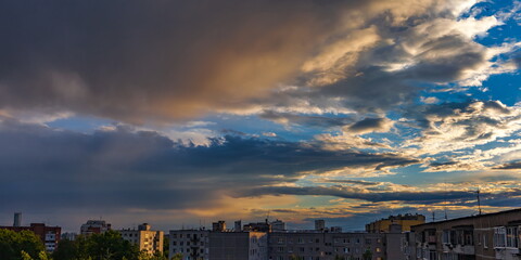 Cloud over the city at sunset in summer
