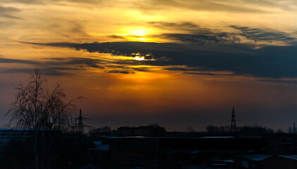 Sunset over the industrial area of the city in winter